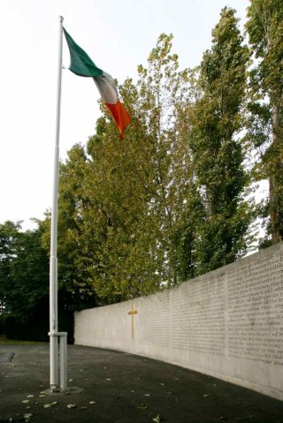 Right hand side of the Arbour Hill Memorial showing tri-colour flag and english side lettering of the 1916 proclamation