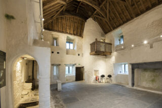 interior view of a room in the castle, with a vaulted wooden ceiling