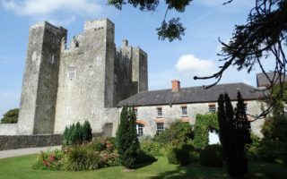 Exterior view of Barryscourt Castle and adjacent cottage