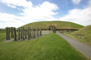 Eastern view of Knowth Mound with reconstructed timber circle.