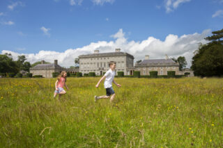 Children running through the flower meadow at Castletown House