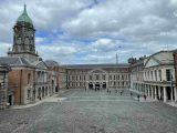 Wide shot of upper courtyard of Dublin Castle with clouds floating in the sky