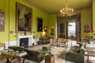 The drawing room with Irish yew settee in front of window.