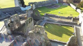 View looking down at cloister and claustral buildings from tower