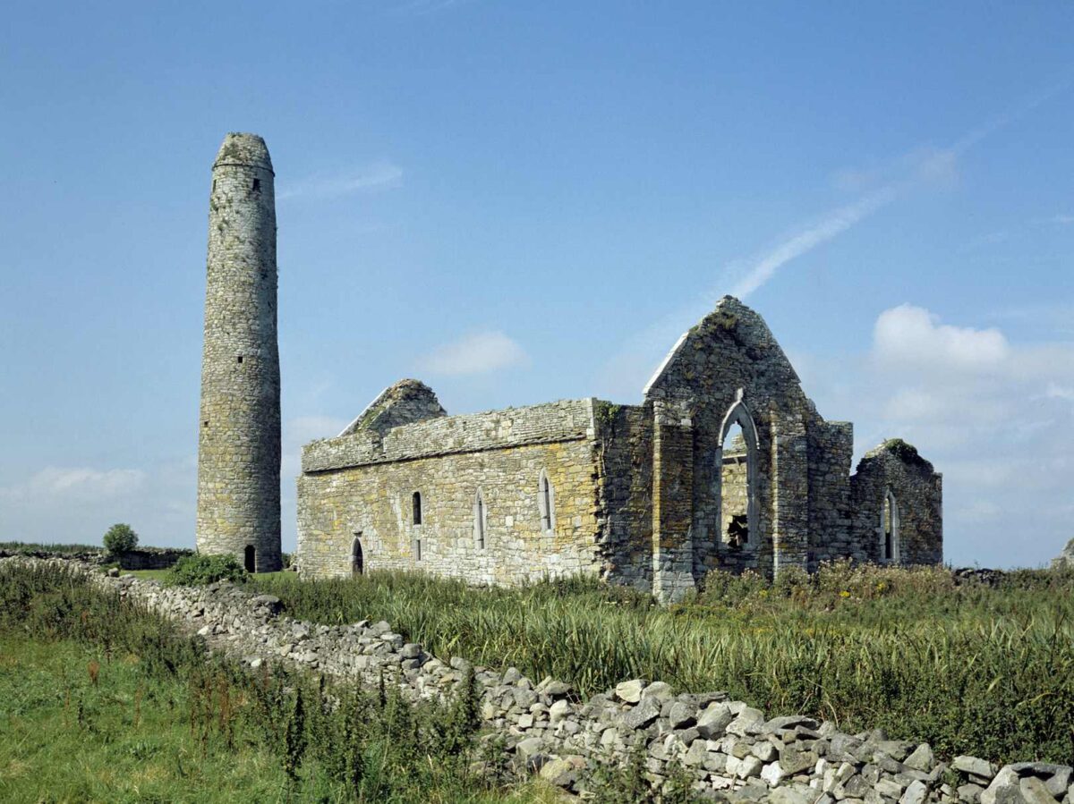 church ruins, with a round tower beside it