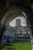 view of the tower of the abbey through an arch