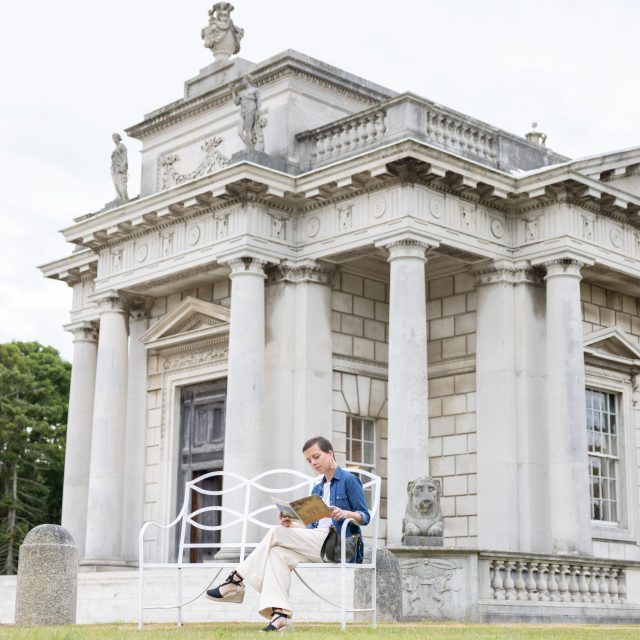 Woman reads outside Casino Marino