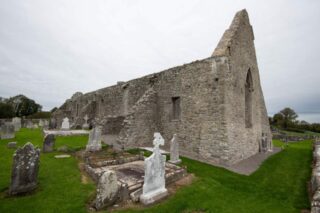 Drumlane Abbey with gravestones