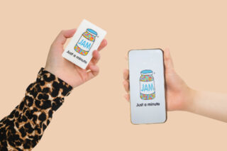 Two hands holding a JAM Card. One is displayed on a phone and the other a paper card.