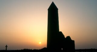 Silhouette of the round tower at Clonmacnoise