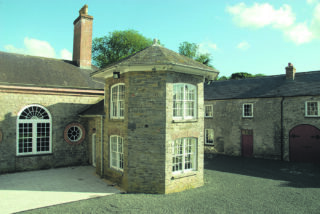 a rounded extension to the main house wing