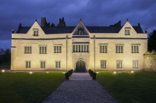 ormond castle floodlit and backdropped by a midnight blue sky