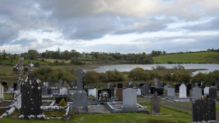 A graveyard looking out over the lake at Drumlane Abbey