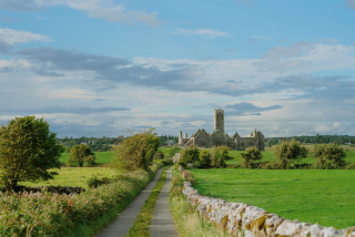 A distant shot of the Friary from the road leading up to it