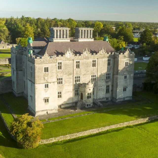 An aerial view of Portumna Castle with the gardens in the foreground. The castle is a mixture of medieval and Renaissance style that complement each other perfectly.