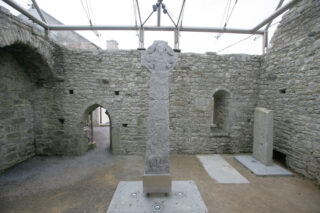 The Doorty high cross situated within the renovated chapel ruins under the new glass roof