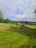 the green fields and mountains in the background with knockroe passage tomb in the back centre