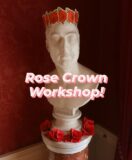 A paper rose crown on a male marble bust