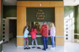 Corlea Trackway Visitor Centre, a family looks at the display.