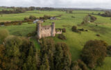 aerial view of the ruined castle among the trees