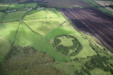 The circular remains of a monastic settlement visible within the field system from this aerial shot