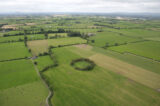 An almost round circle fort is visible within the field system from this aerial shot