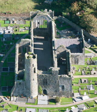 closer aerial view showing the interior ruins of the church