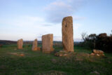 Four standing stones lined up in a row, of differing heights