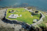 an aerial view of the small monastic island, with fort and structural remains