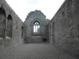 internal view of the priory walls, facing the arched window.