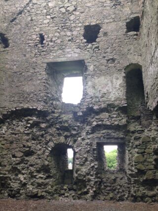 the interior stone walls of the castle, with the markings of the windows