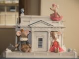 Mice toys sitting on a miniature of the Casino Marino