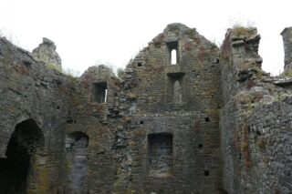 the towering internal ruins of what is left of the original infirmary building