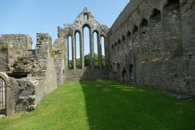 5 arches within the large window where stained glass would have once existed