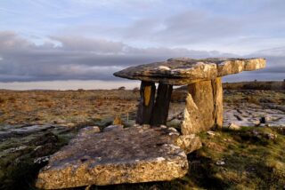 the stone dolmen lit in the evening sun