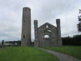 view of the church ruins, and the round tower standing beside it on the left.