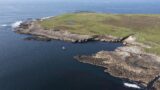 an aerial view of the island and its shoreline