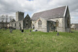 exterior of two churches with nearby graves