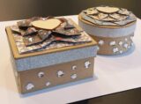 Azure boxes sit on a white table.