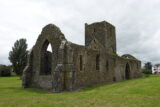 long view of the exterior of the roofless friary building