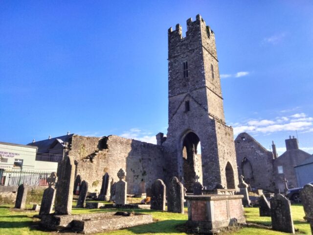 the friary ruins within the graveyard grounds
