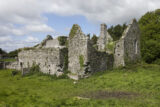 exterior view of church ruins, with ivy running up some of the outside walls.