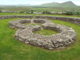 2 stone forts conjoined in a larger stone enclosure