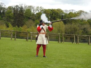 Musketeer in action at history shooting display