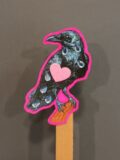 A 2D raven stick puppet with a pink outline and heart.