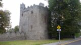 exterior view of the multi-storeyed castle, with a bawn wall attached