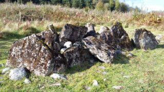 a series of stones clustered close together to make the tomb