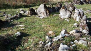 stones placed randomly within a small area that make up the tomb.