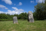 two standing stones, one is much smaller than the other