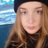 A lady wearing a black hat.